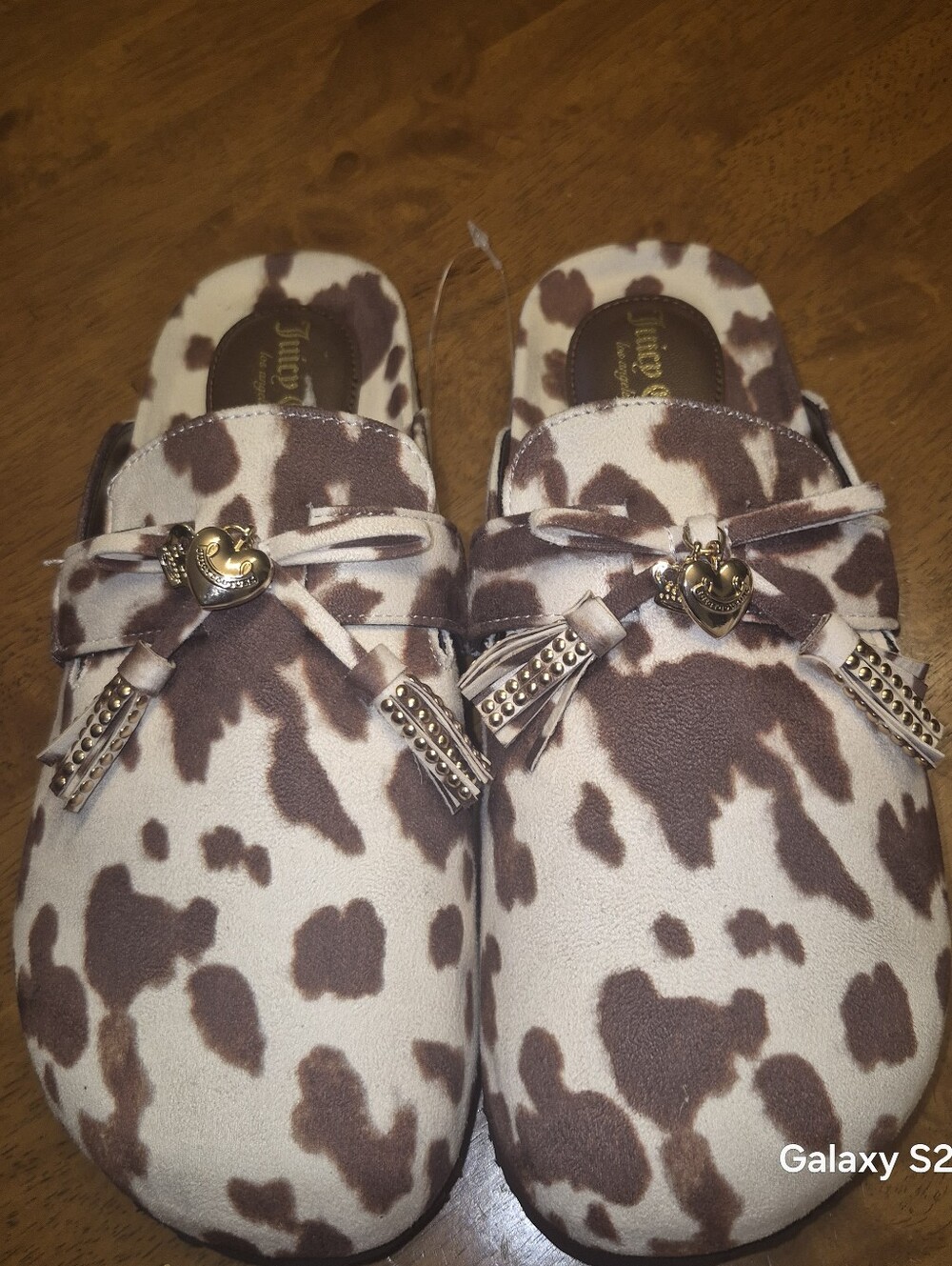 Womens  Cow-Print Slip-On Mules with Tassel Accent